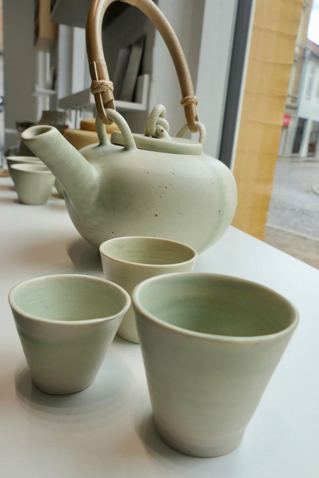 Tiny glossy light green cups