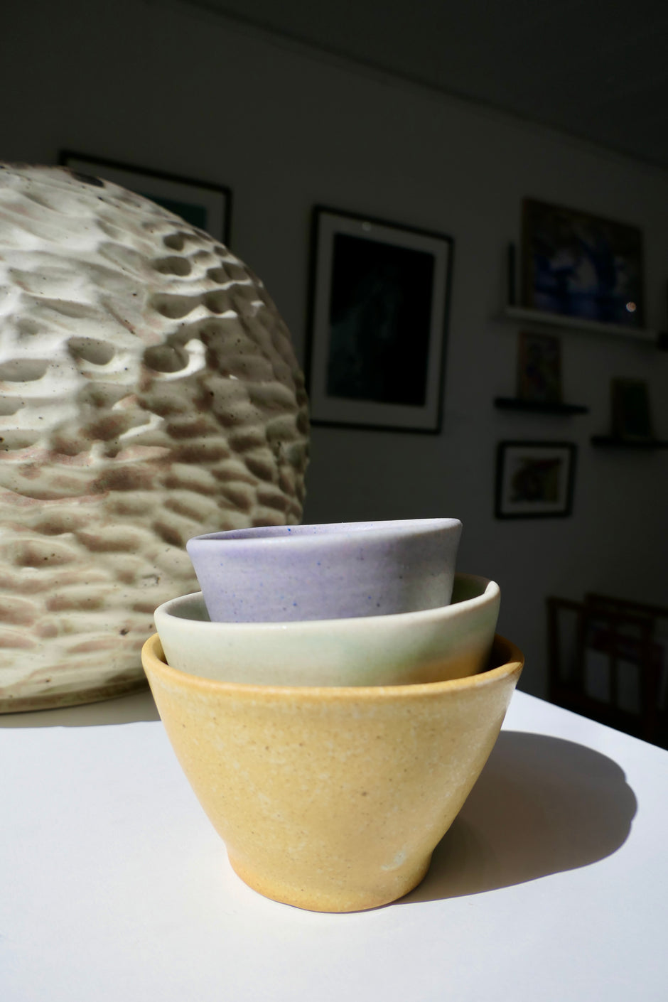 Tiny glossy light green cups