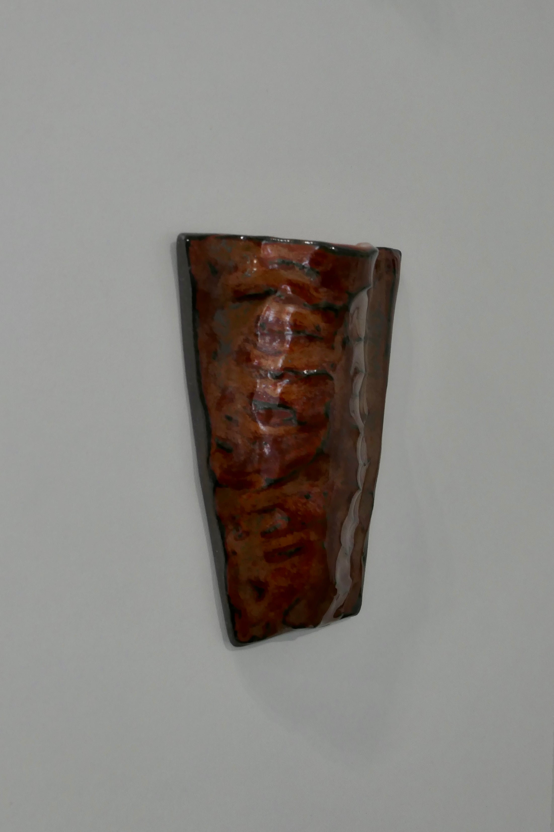 Flat dark red wall vase