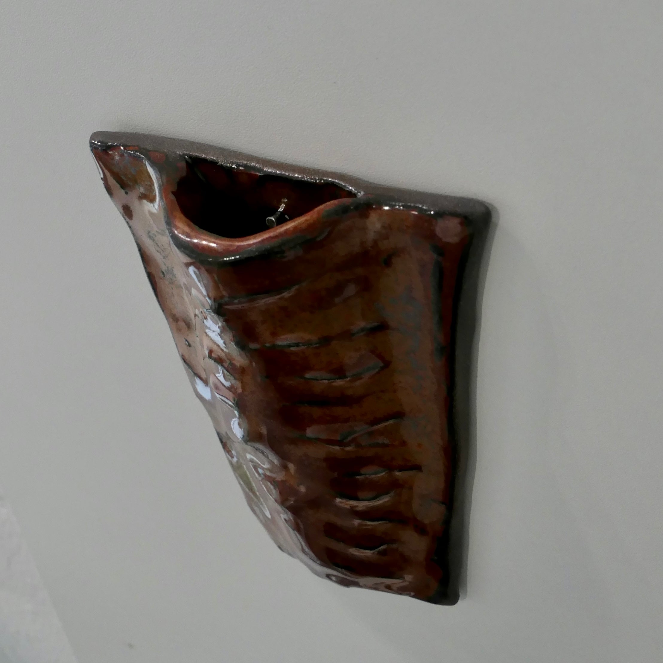 Flat dark red wall vase