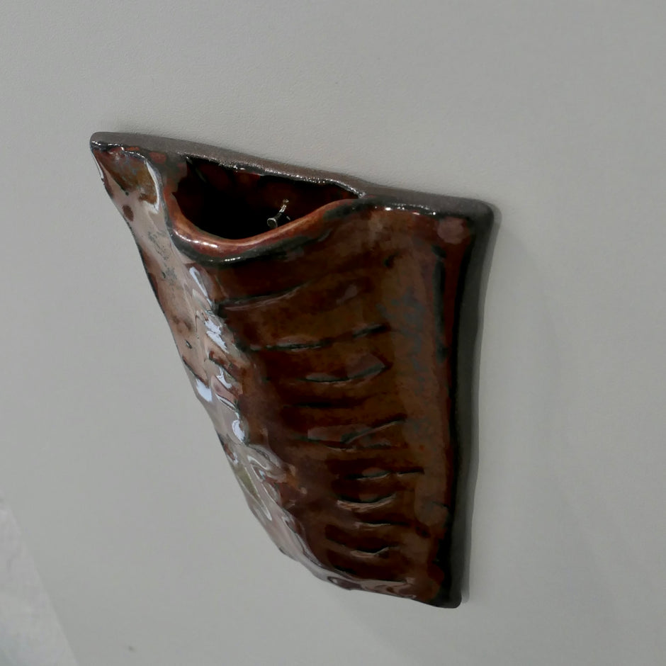 Flat dark red wall vase