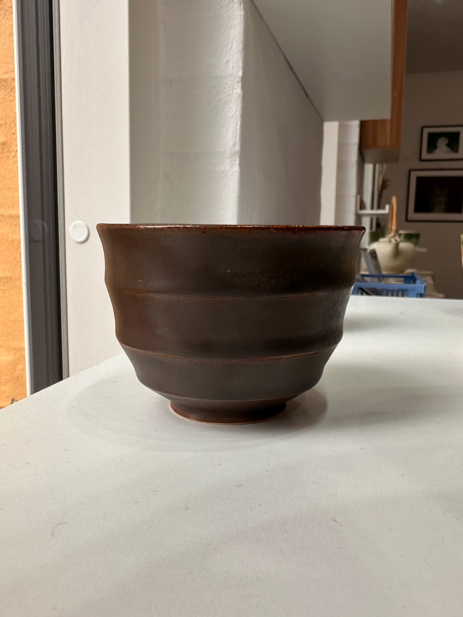 Wavy dark brown cup