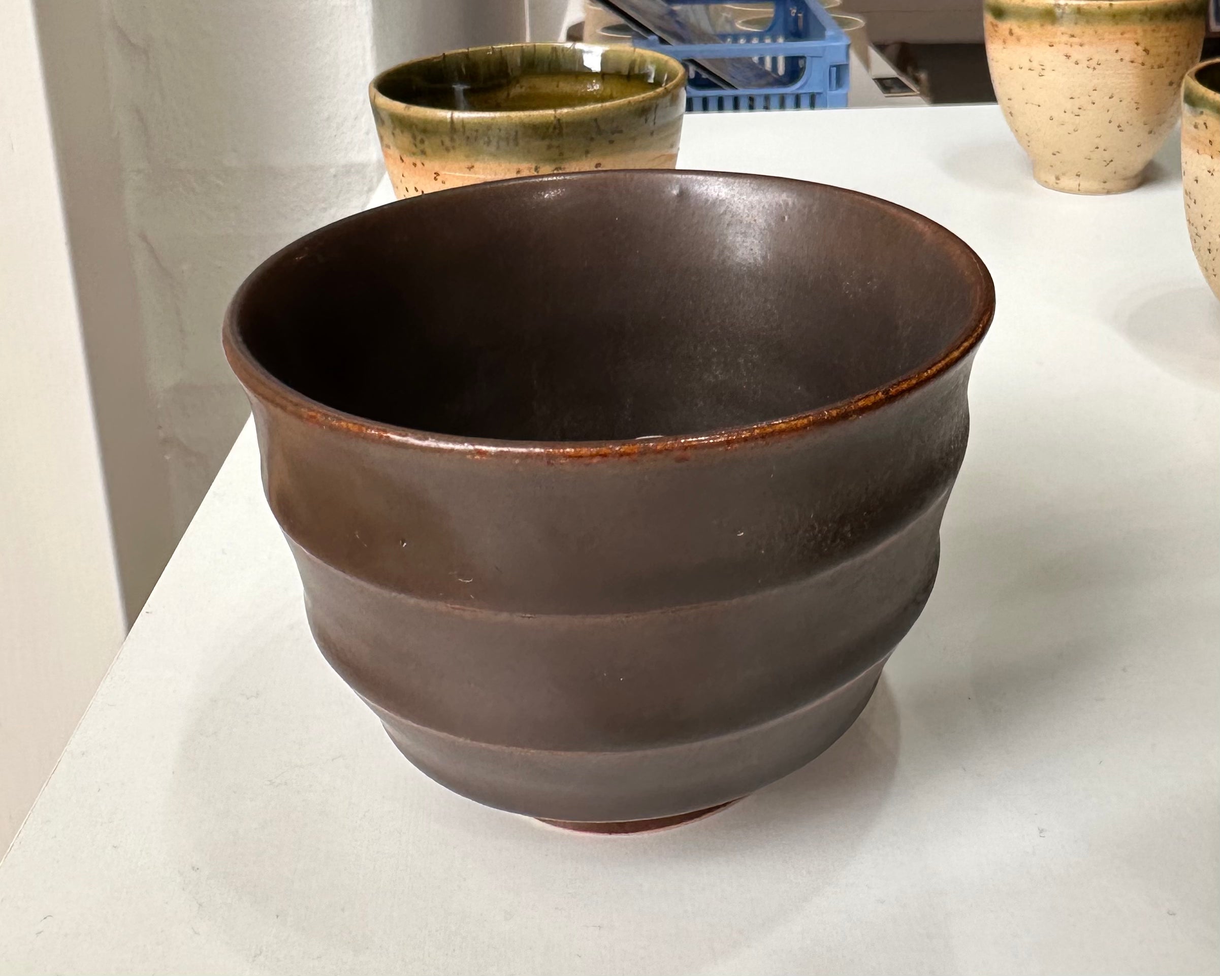 Wavy dark brown cup