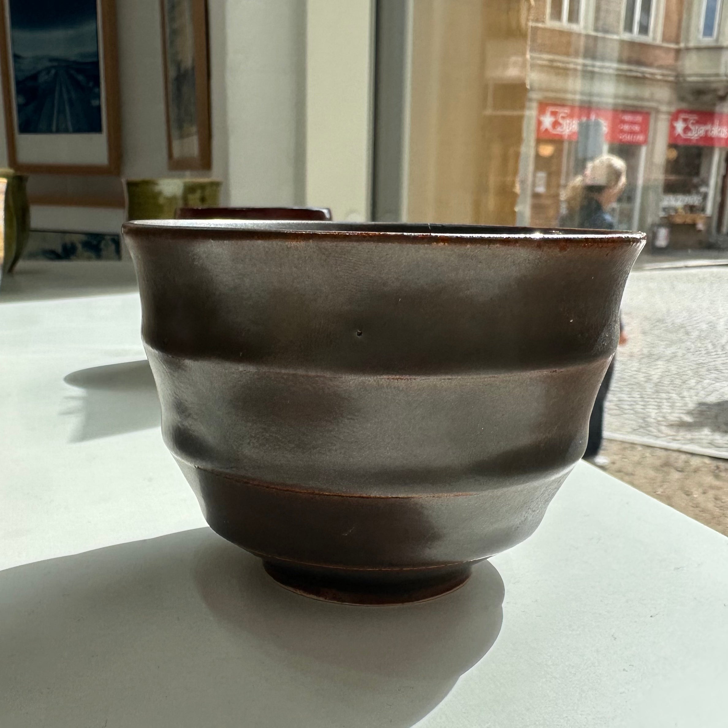 Wavy dark brown cup