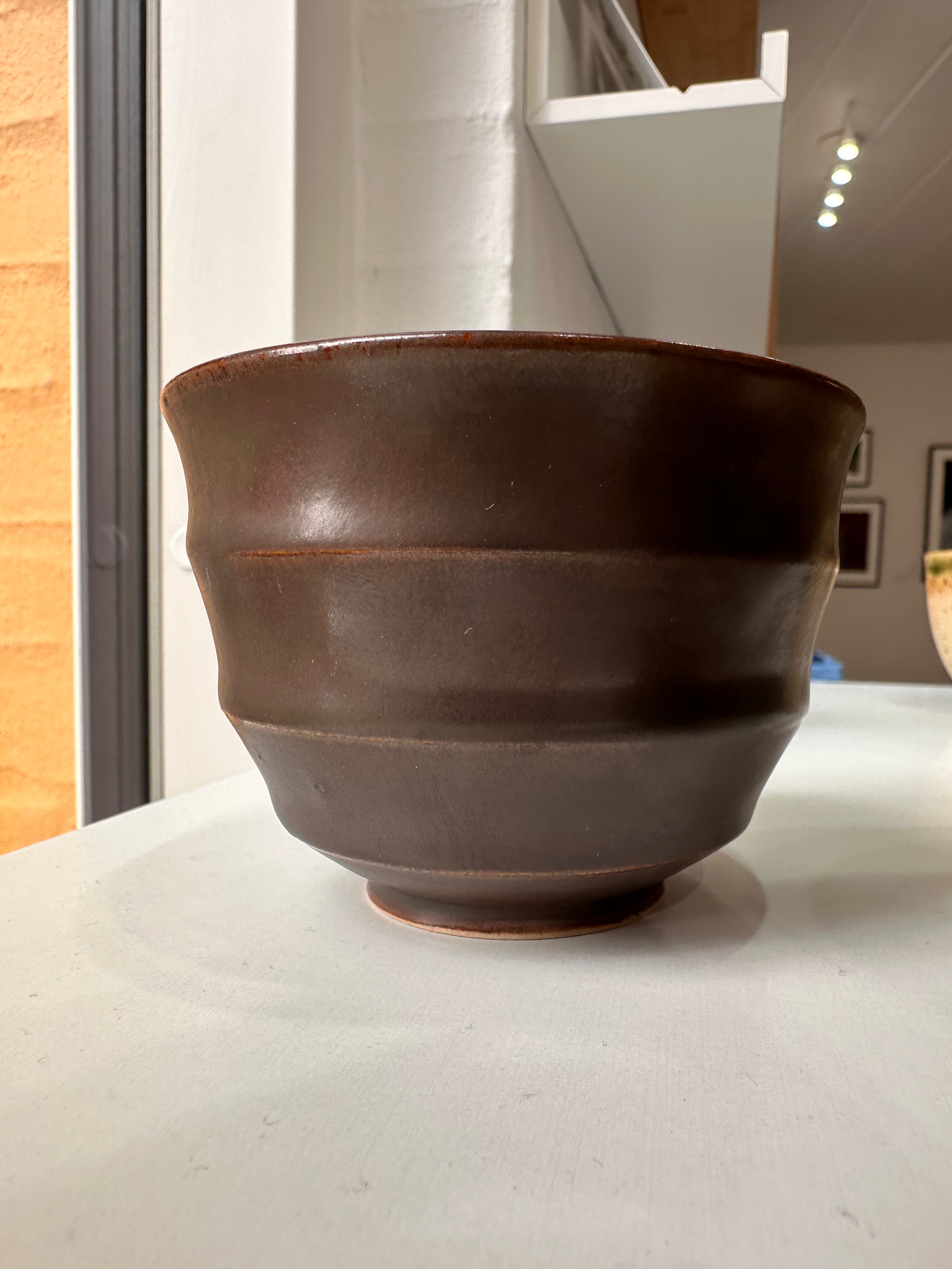 Wavy dark brown cup