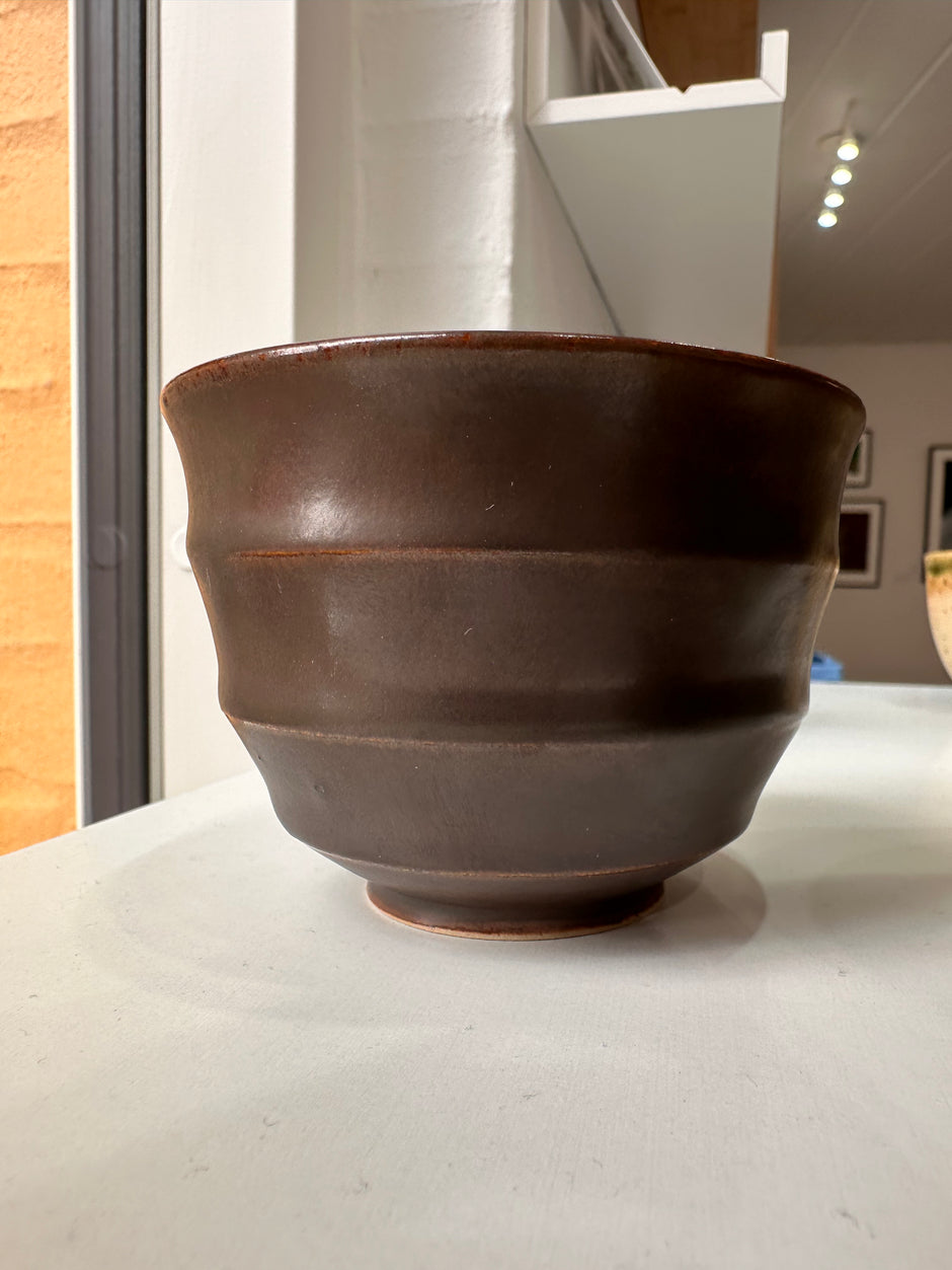 Wavy dark brown cup